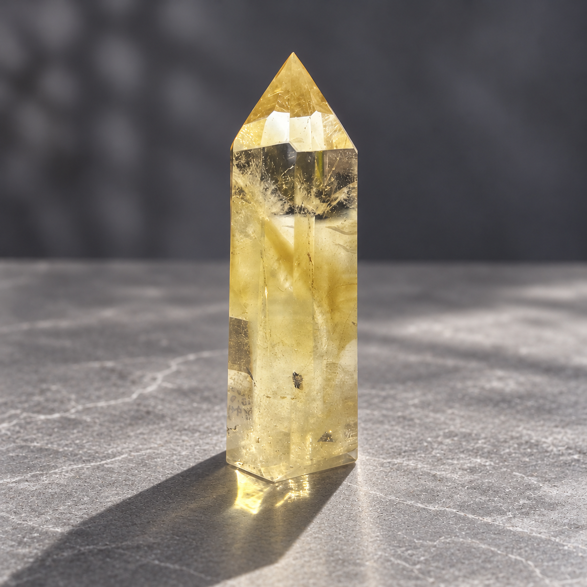 Brazilian citrine tower #3, side view with clear windows, golden veils and visible dark inclusions