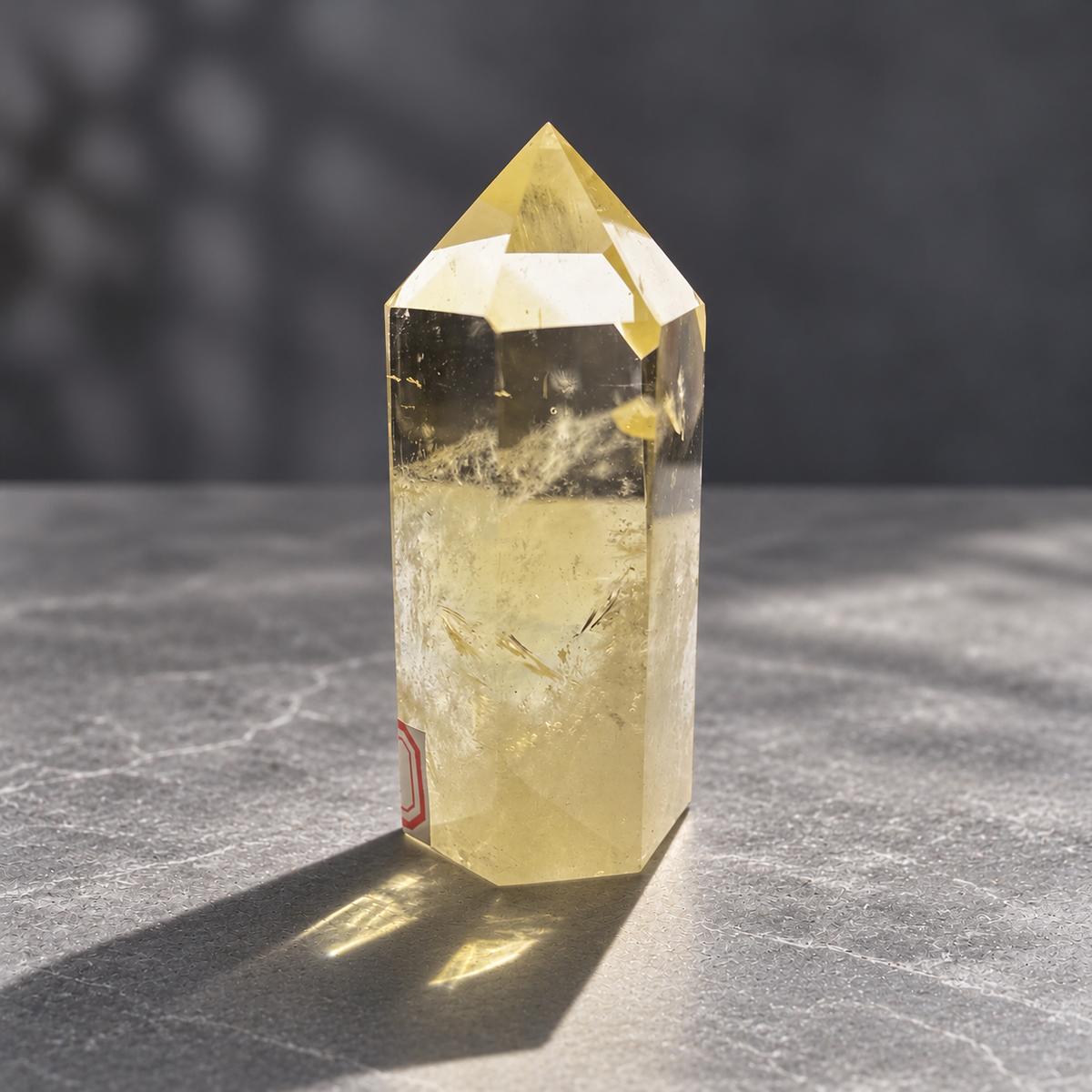 Side view of Brazilian citrine tower #4 showing its pale golden colour and natural internal fractures