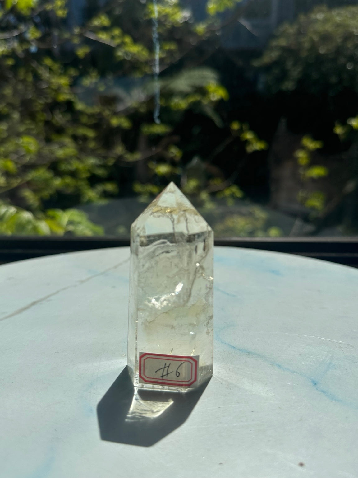 Original sunlight front photograph of Brazilian pale yellow champagne citrine tower #6, with handwritten number 6 label