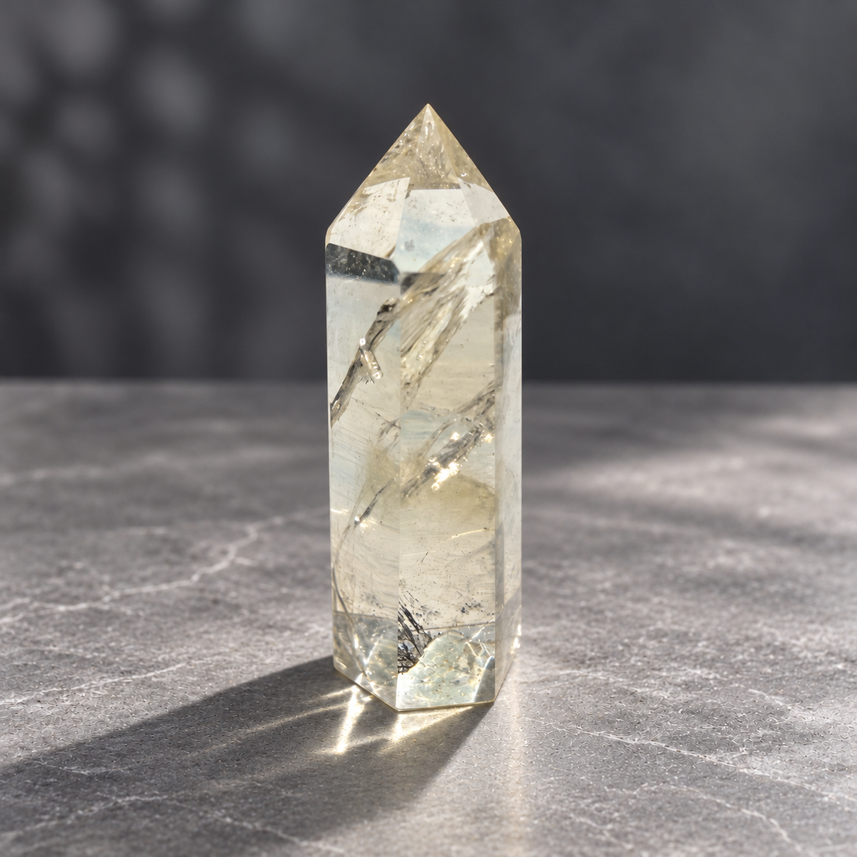 Brazilian pale yellow champagne citrine tower #6, 129g, side view with very pale champagne colour, transparent windows and diagonal natural fracture veils