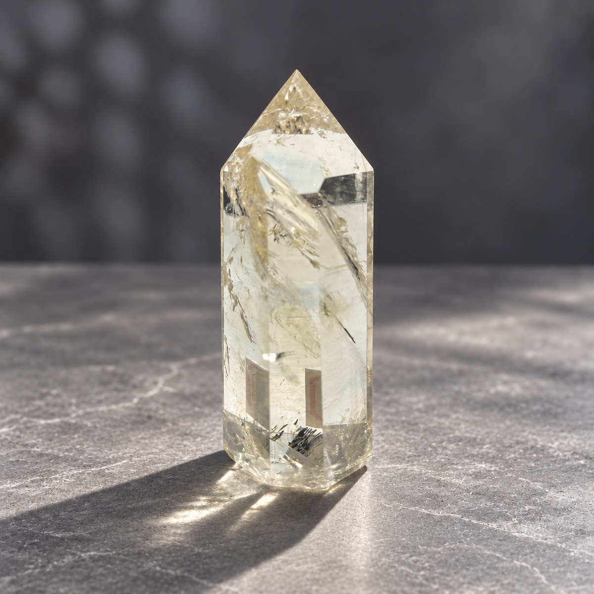 Brazilian pale yellow champagne citrine tower #6, 129g, opposite side showing diagonal internal veils and small dark inclusions near the base