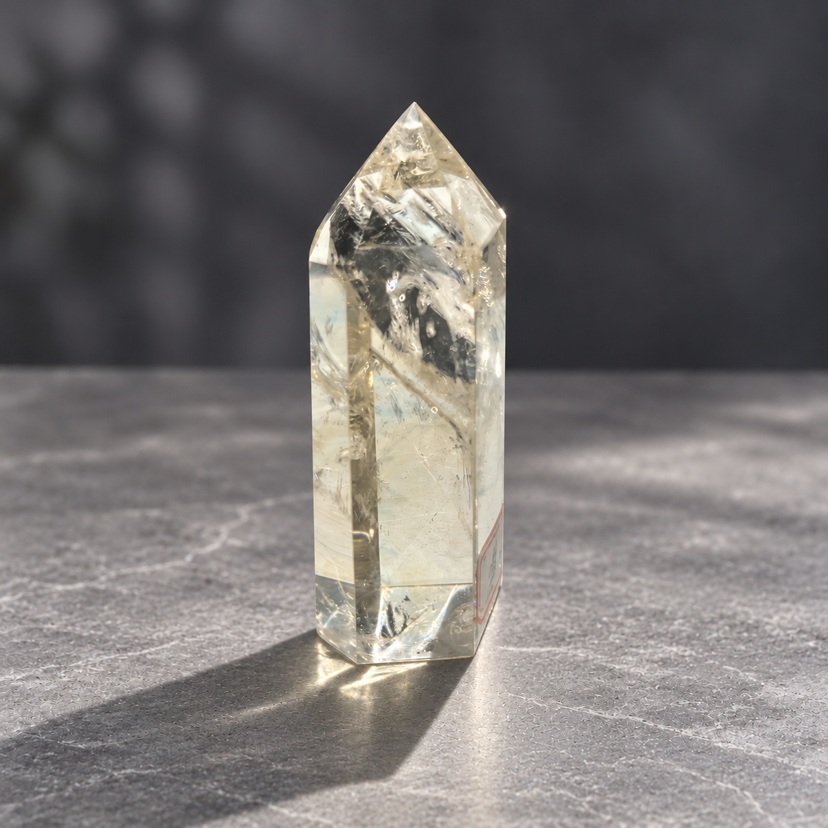 Brazilian pale yellow champagne citrine tower #6, 129g, narrow side with pale yellow tone and broad natural reflective fracture planes
