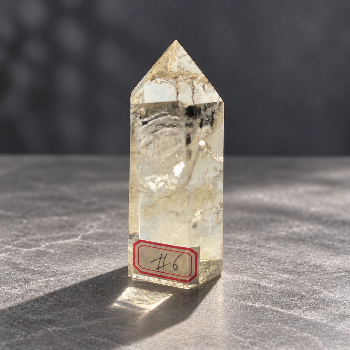 Brazilian pale yellow champagne citrine tower #6, 129g, alternate front view showing subtle champagne tint and rippled internal fractures