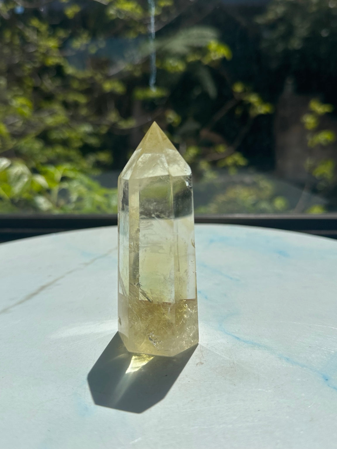 Original sunlight photograph of exact Brazilian citrine tower #7 showing pale champagne colour, transparent upper areas and warmer base