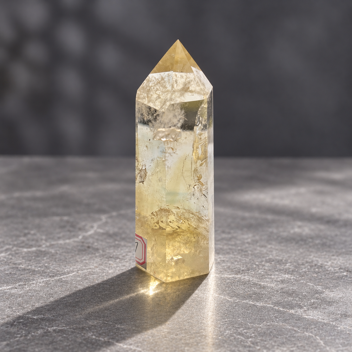 Side view of citrine tower #7 showing feathery internal textures and pale yellow colour