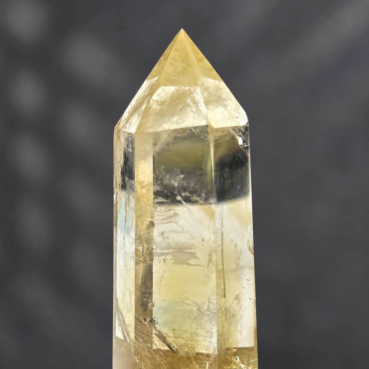 Close detail of the same Brazilian pale yellow champagne citrine tower #7, showing polished tip and transparent upper window