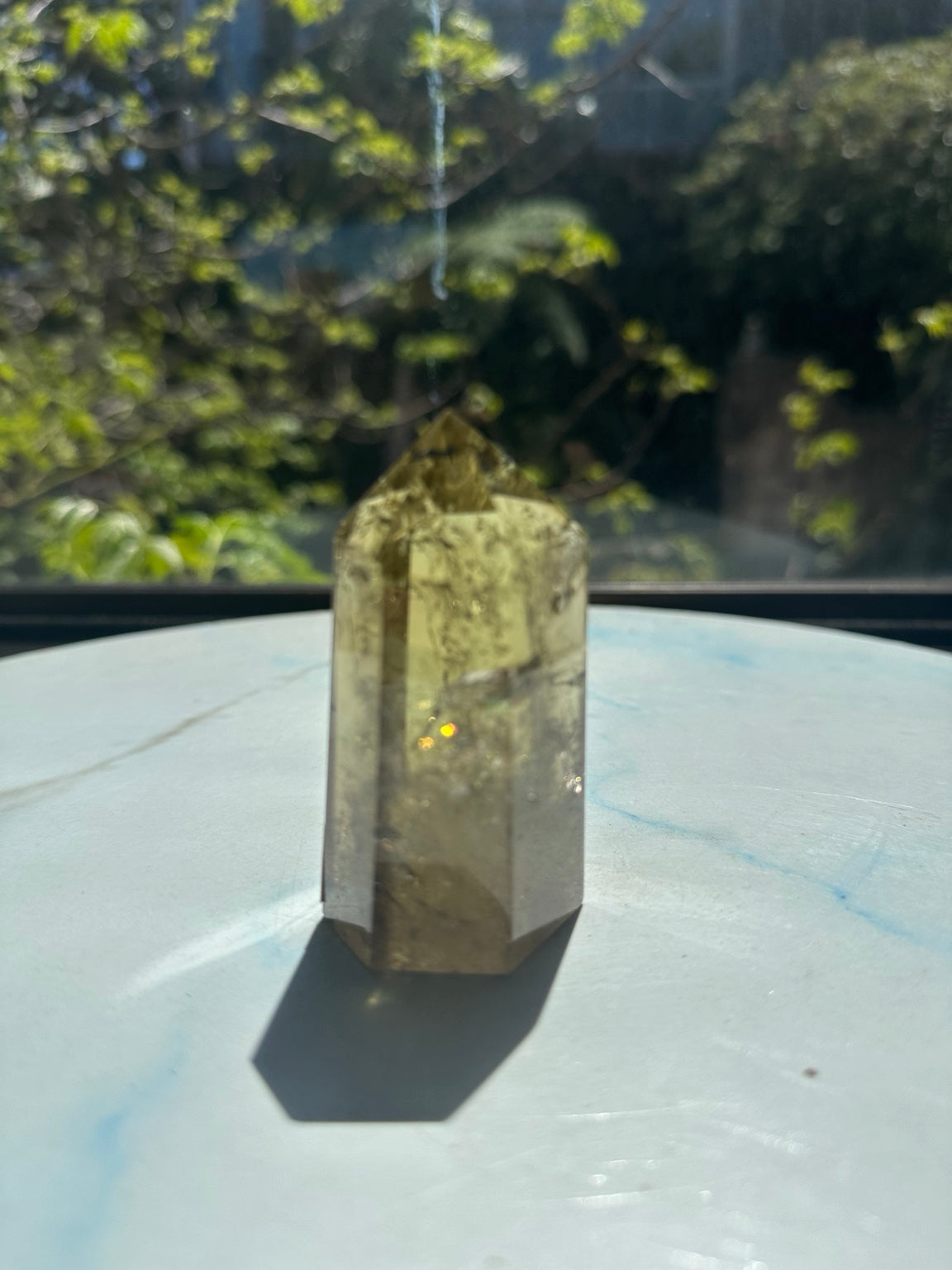 Brazilian pale yellow champagne citrine tower #8, 164g. Original sunlight side photograph showing real champagne colour, internal veil and small warm rainbow glint
