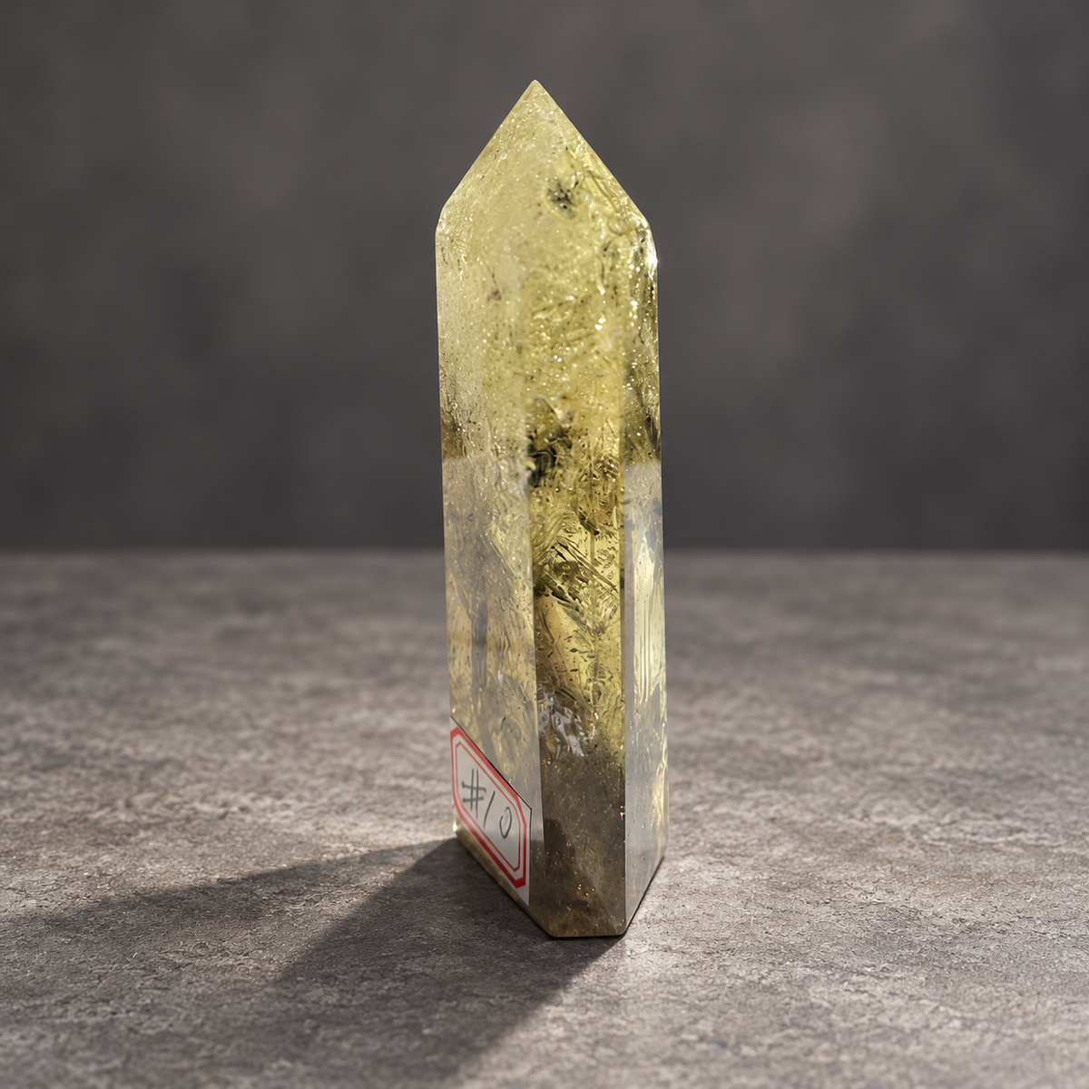 Brazilian citrine tower #10, pale yellow champagne polished quartz point, 207g. Angle 4 showing natural fractures, veils and varied clarity. Exact piece photographed.