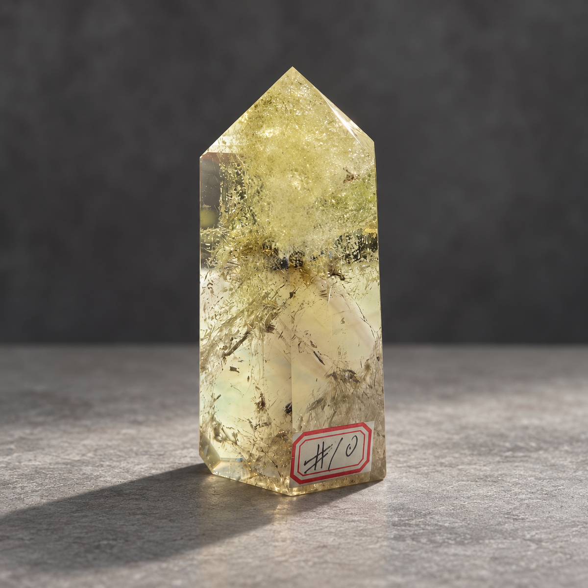Brazilian citrine tower #10, pale yellow champagne polished quartz point, 207g. Angle 9 showing natural fractures, veils and varied clarity. Exact piece photographed.