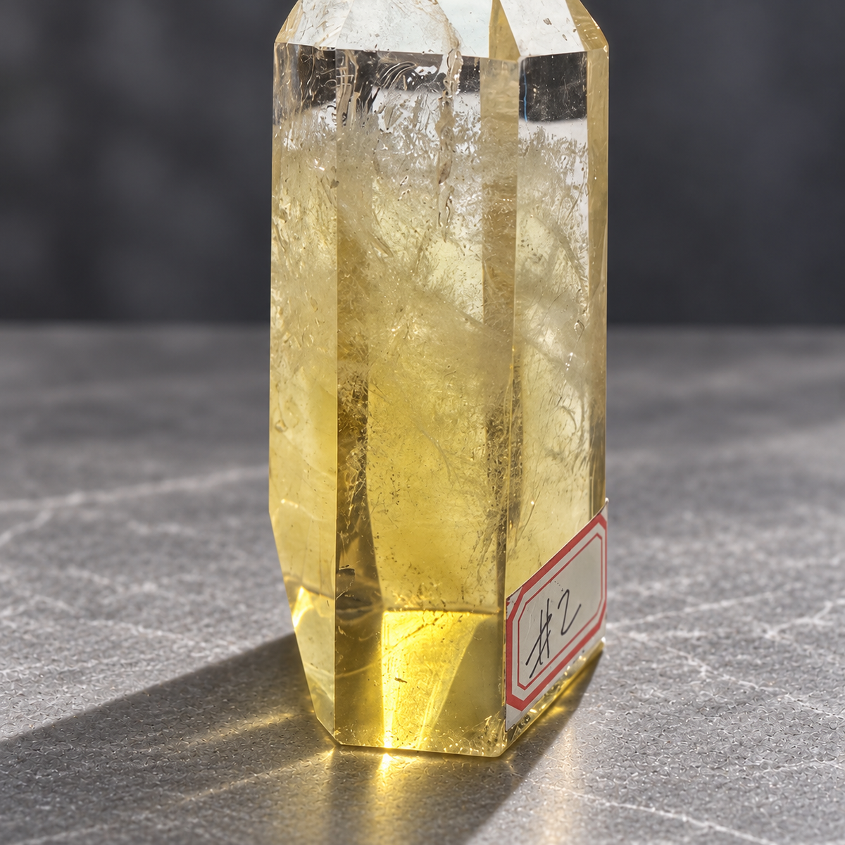 Brazilian citrine tower #2, 151g, base detail view showing polished facets and natural internal veils