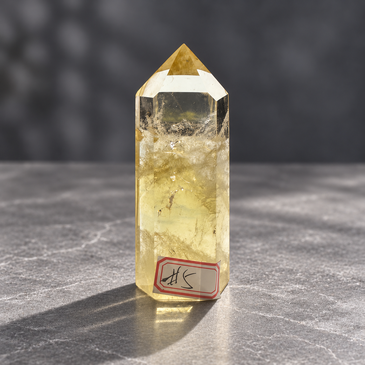 Brazilian citrine tower #5, front view with original number label, clear window and cloudy natural inclusions