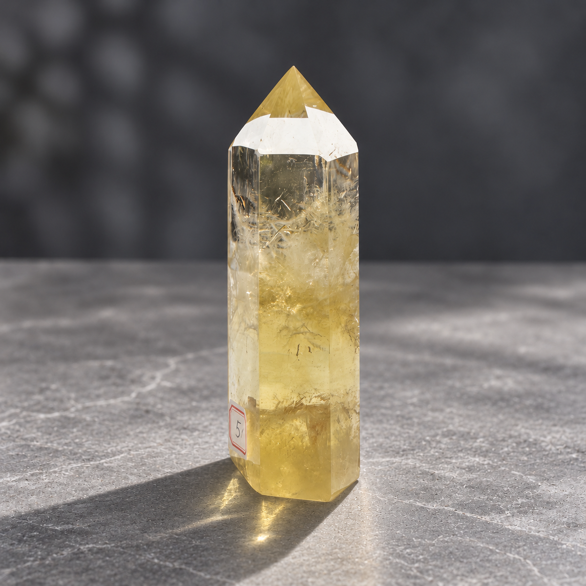 Brazilian citrine tower #5, back angle with champagne colour and original label refracted through the crystal