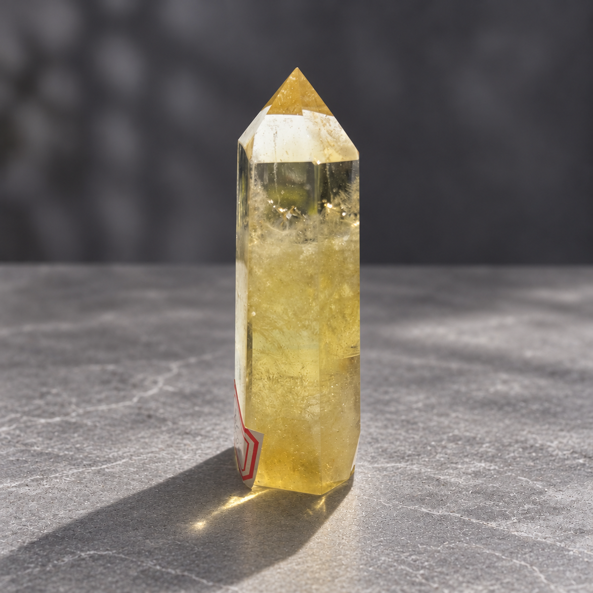Brazilian citrine tower #5, slender side profile with champagne-yellow tones and internal veils