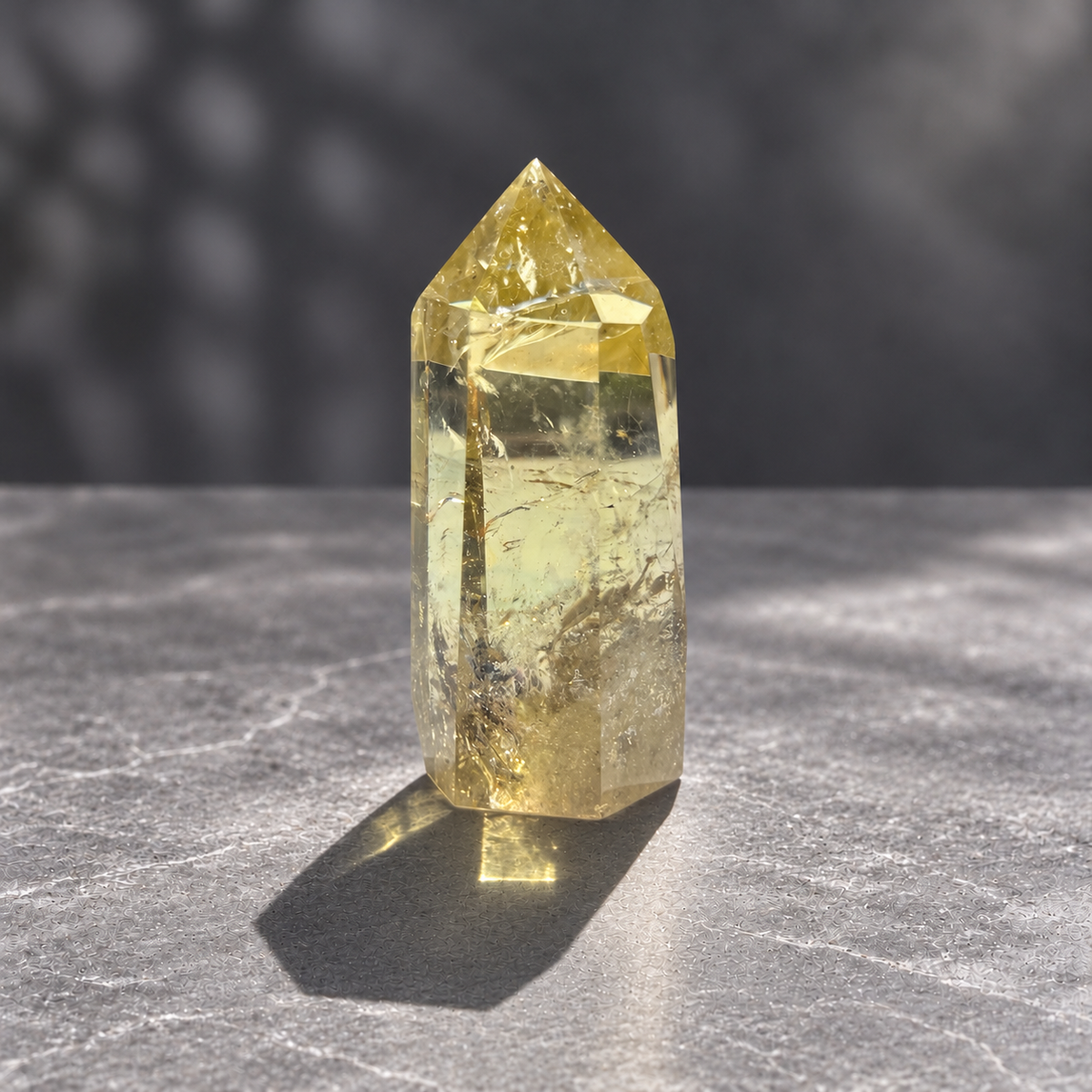 Brazilian citrine tower #9, 228g pale yellow champagne crystal point; polished specimen angle 6 with reflective internal veils and subtle darker inclusions. Exact piece photographed.