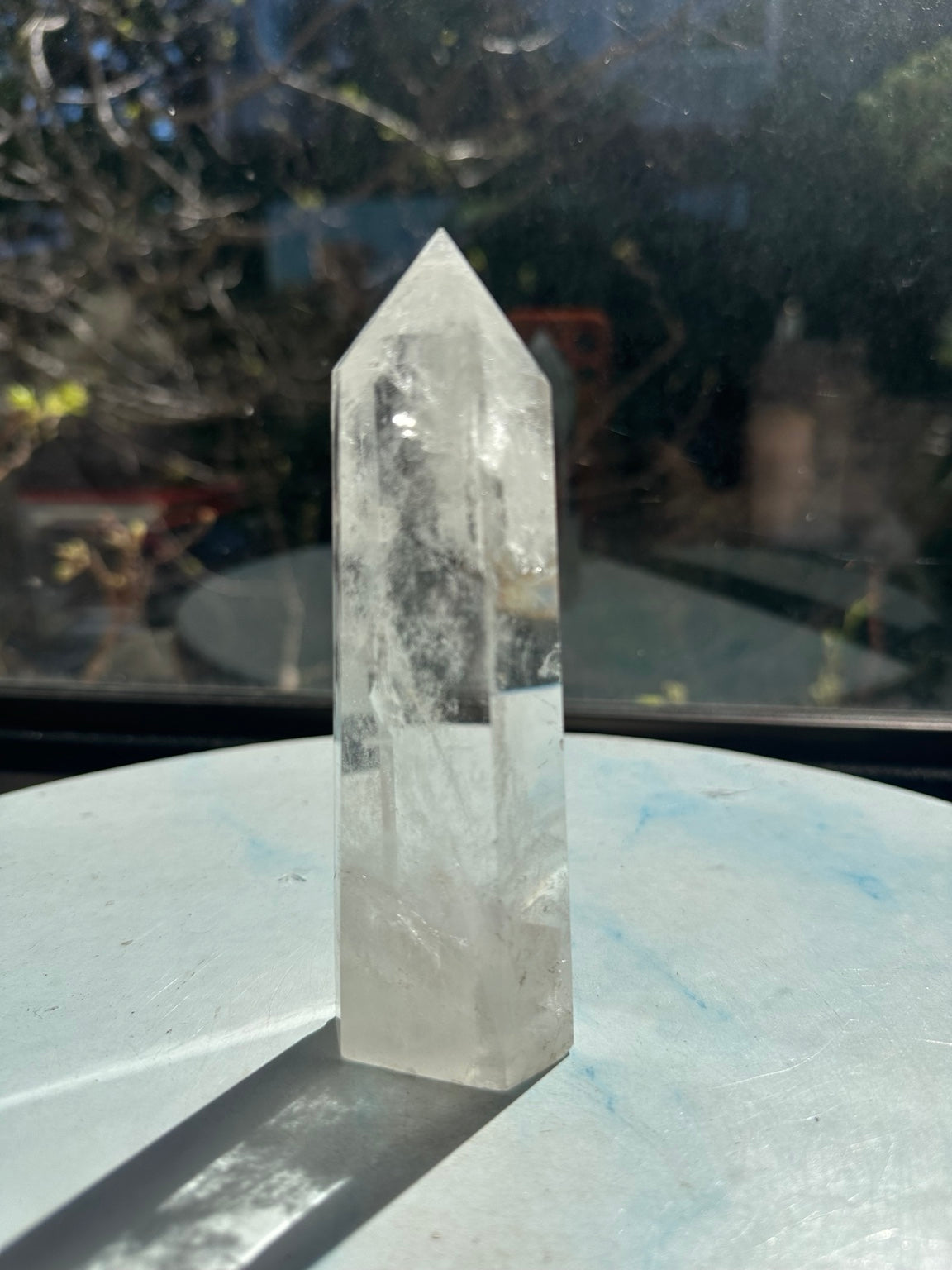 Brazilian clear quartz tower number 8, 232g and 13.2cm tall: opposite side showing fine internal textures and cloudy areas near the base.