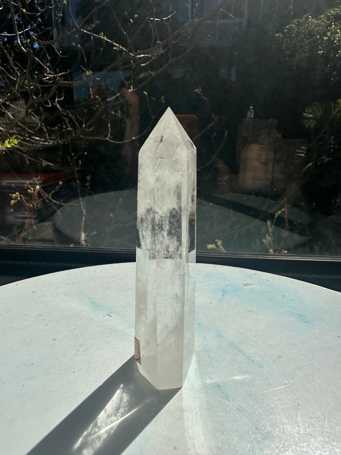 Brazilian clear quartz tower number 8, 232g and 13.2cm tall: narrow side showing its slender shape and polished pointed top.