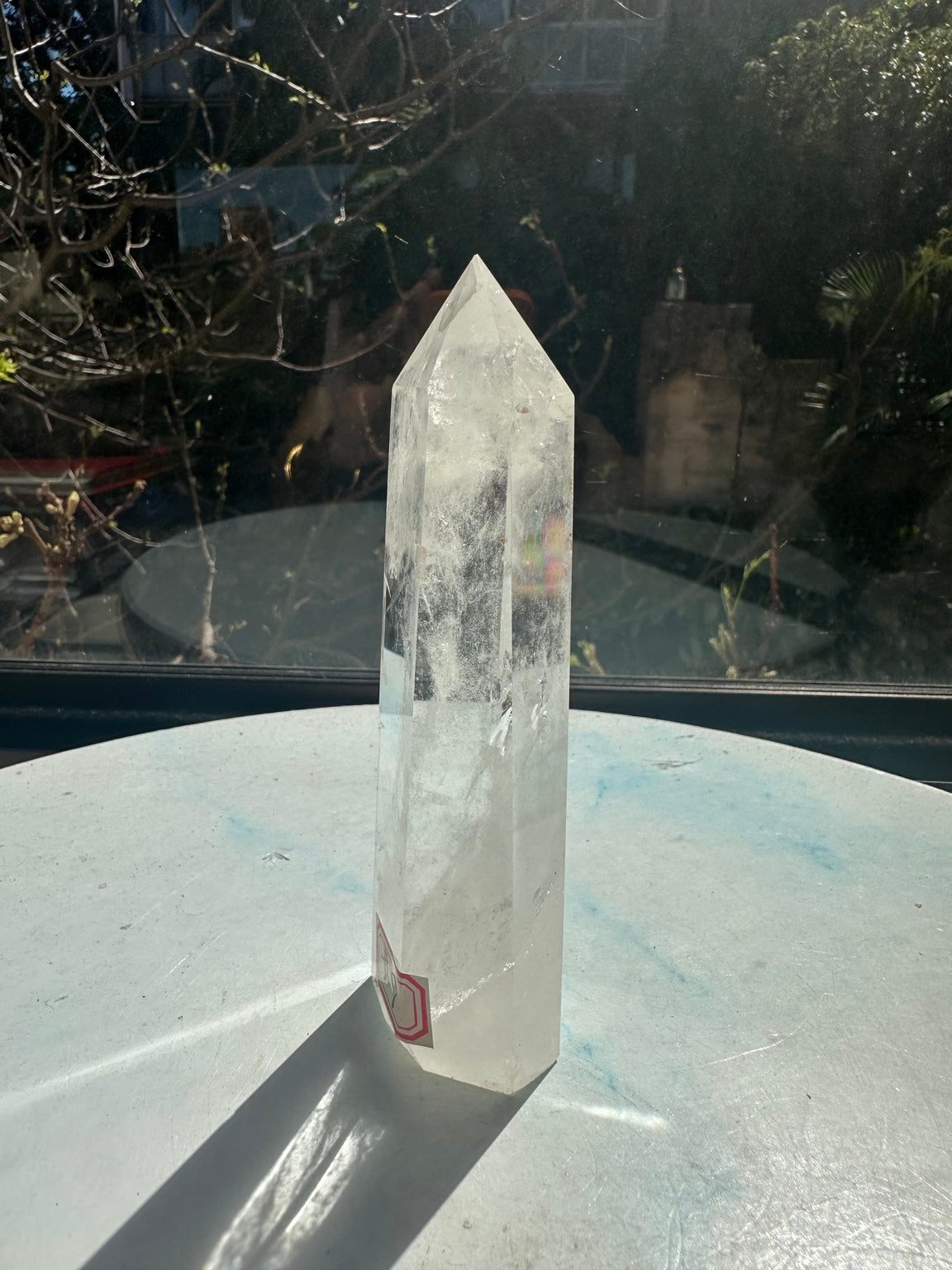 Brazilian clear quartz tower number 8, 232g and 13.2cm tall: three-quarter view with the number 8 label at the lower left.