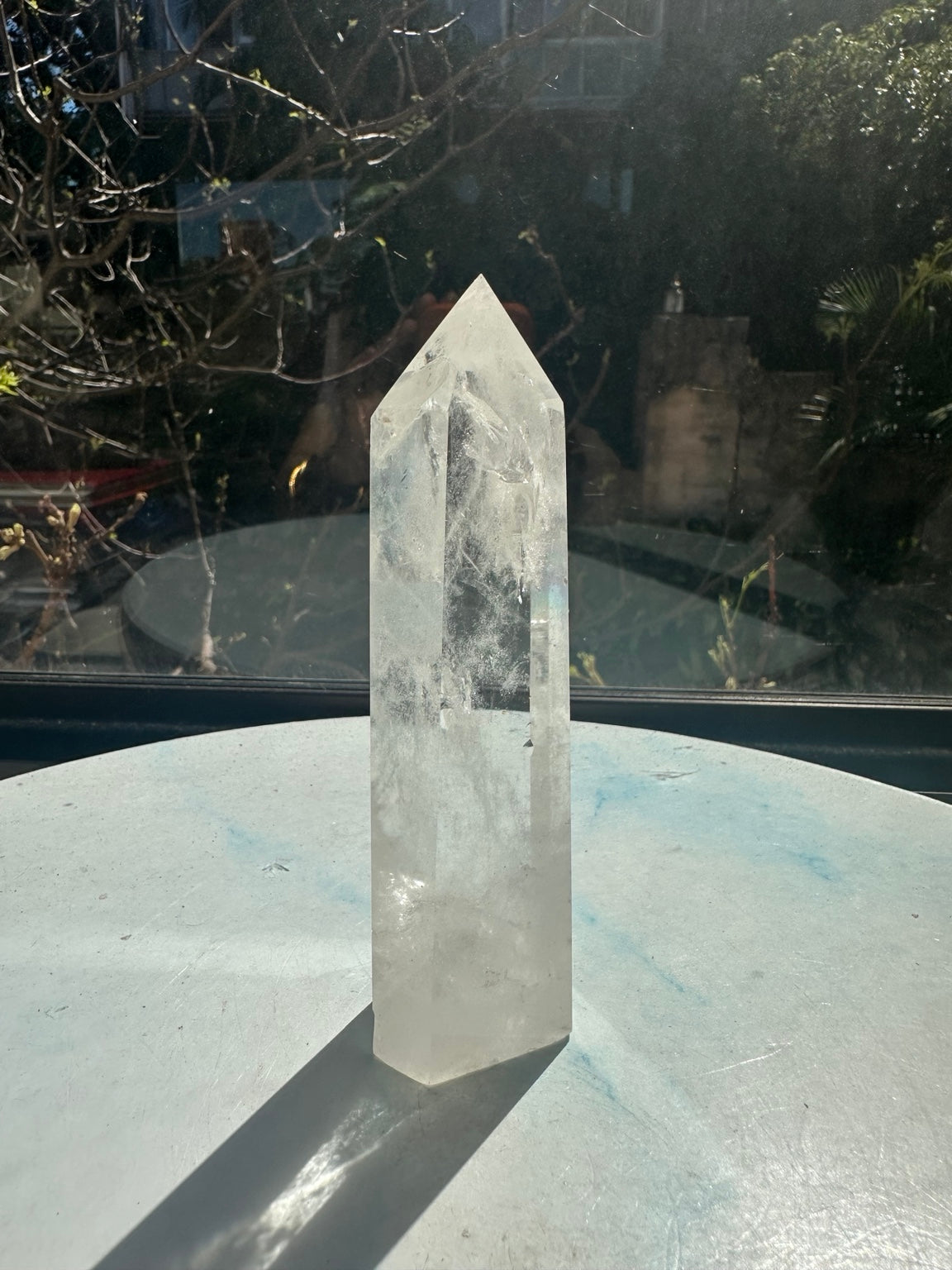 Brazilian clear quartz tower number 8, 232g and 13.2cm tall: reverse side without a label showing natural white veils and a pointed top.