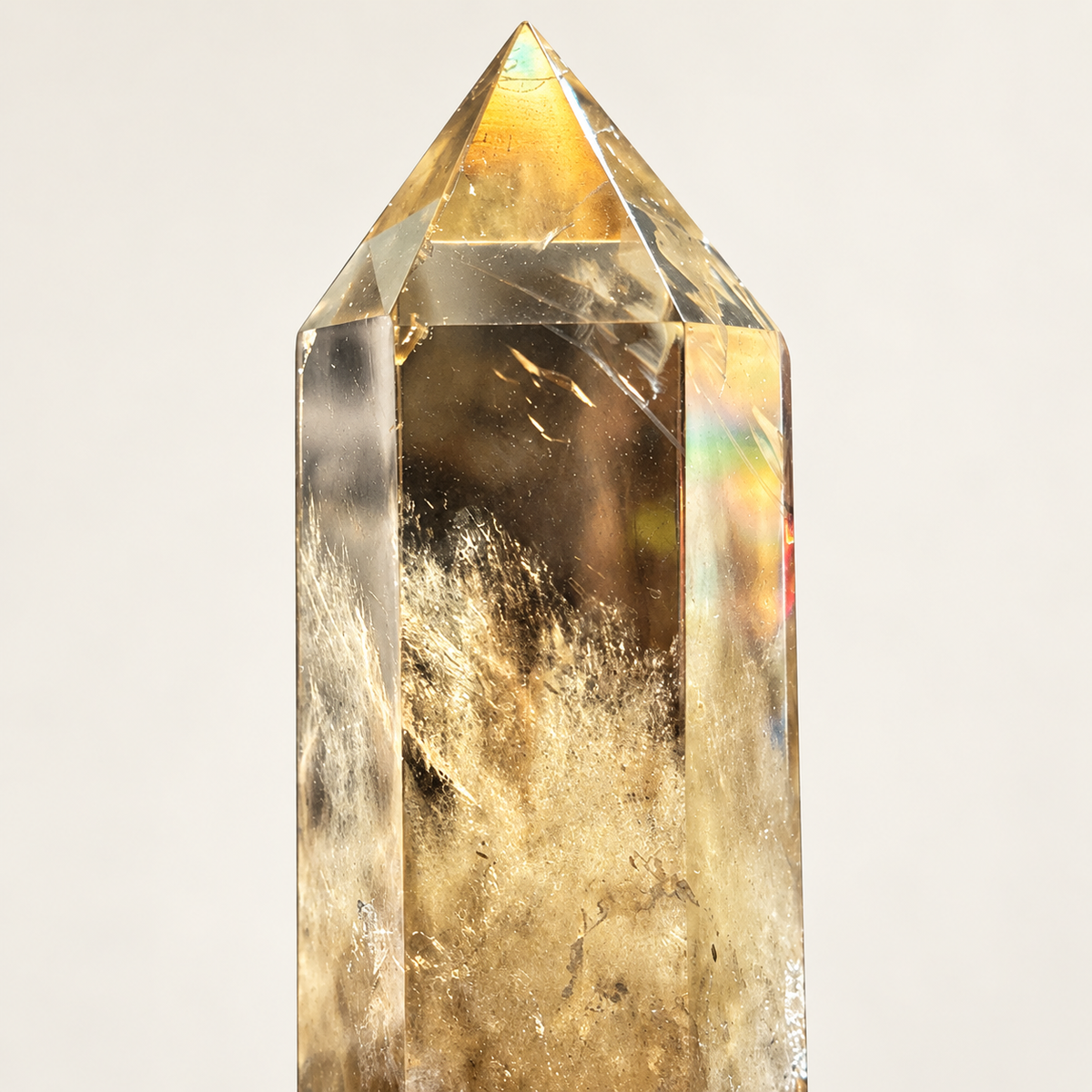 Close-up of faceted point and natural inclusions in smoky citrine