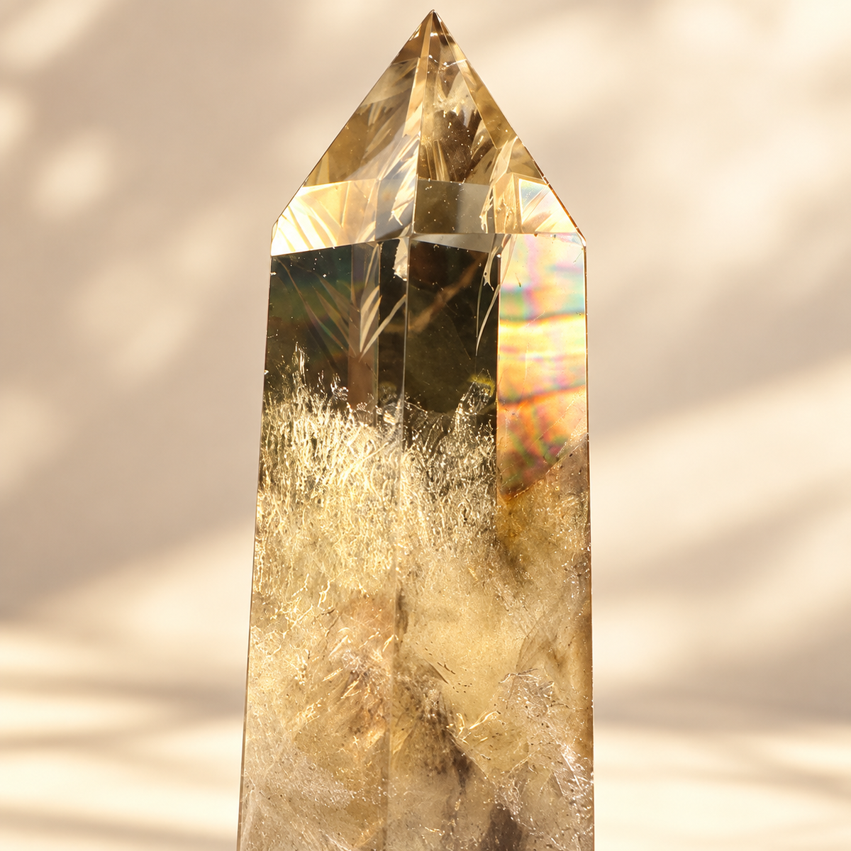 Close-up of rainbow reflections and internal veils in the exact smoky citrine tower