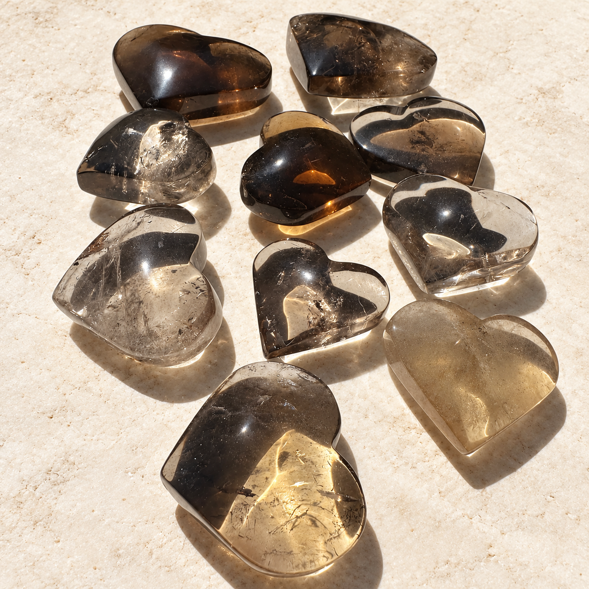 Group of Brazilian smoky quartz hearts showing natural variation in colour; sold individually