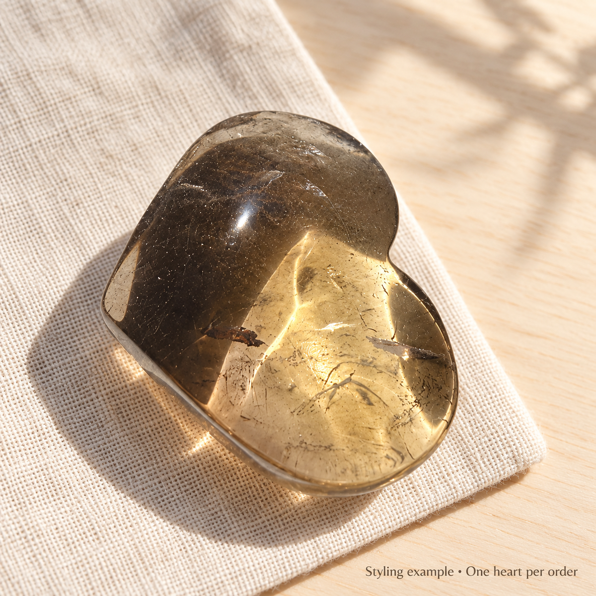 Smoky quartz heart styled on linen and wood; styling example, one heart per order