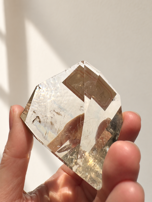 Exact citrine piece #2, 106g — main photo with soft indoor natural light and cream wall background