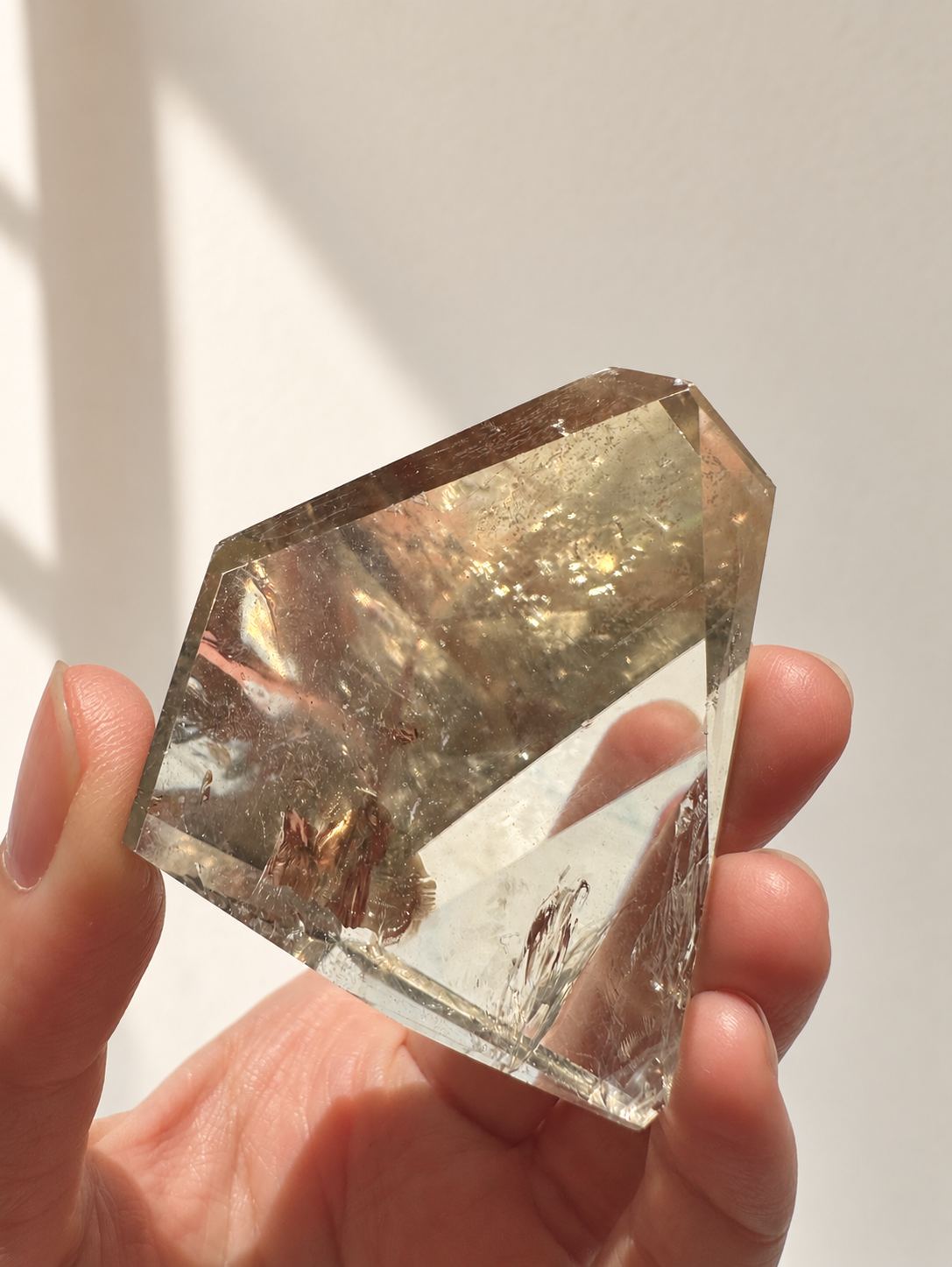 Natural Brazilian citrine 106g exact piece #2 view 3 in soft natural daylight against warm ivory wall