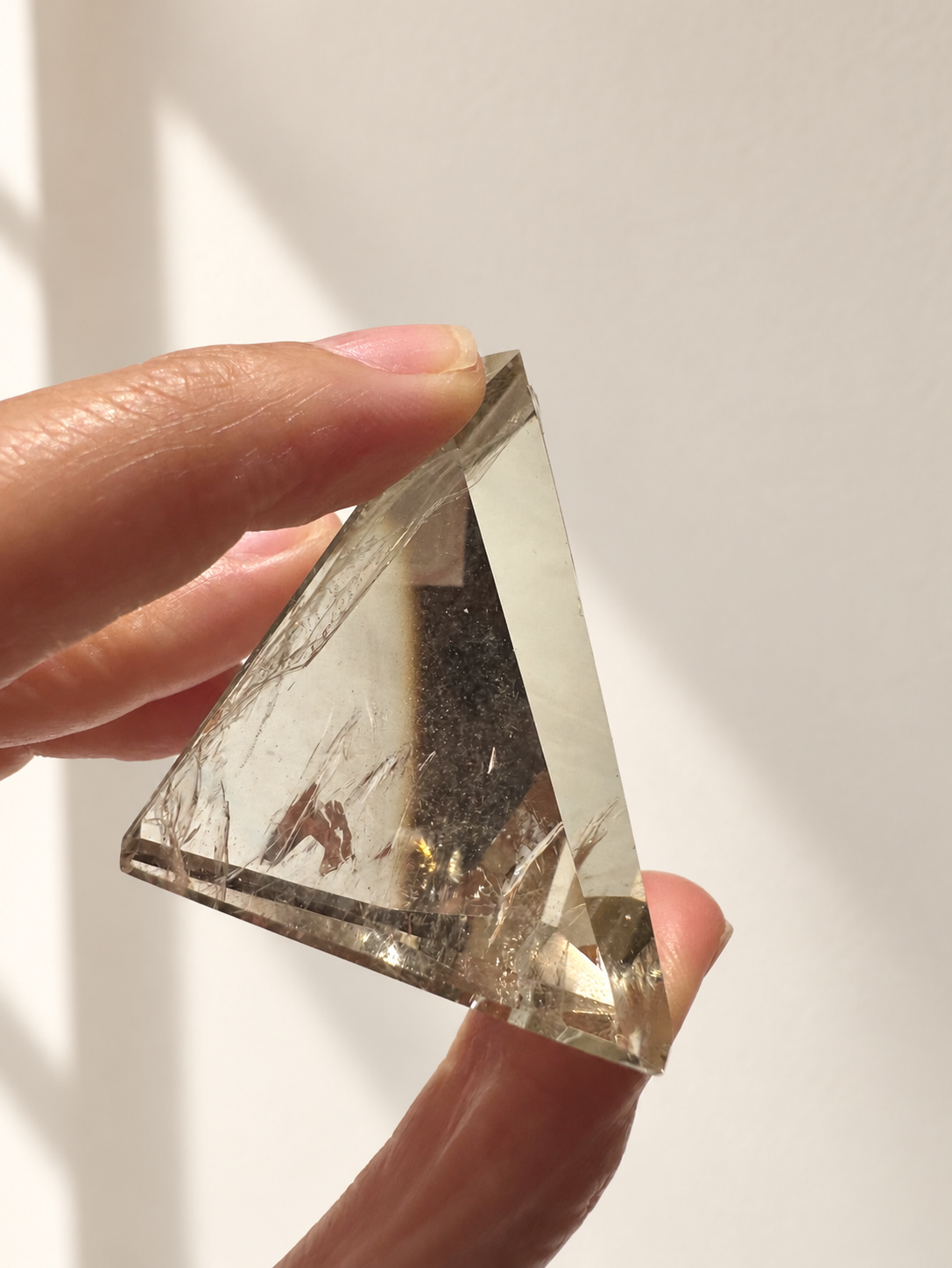 Natural Brazilian citrine 106g exact piece #2 view 4 in soft natural daylight against warm ivory wall