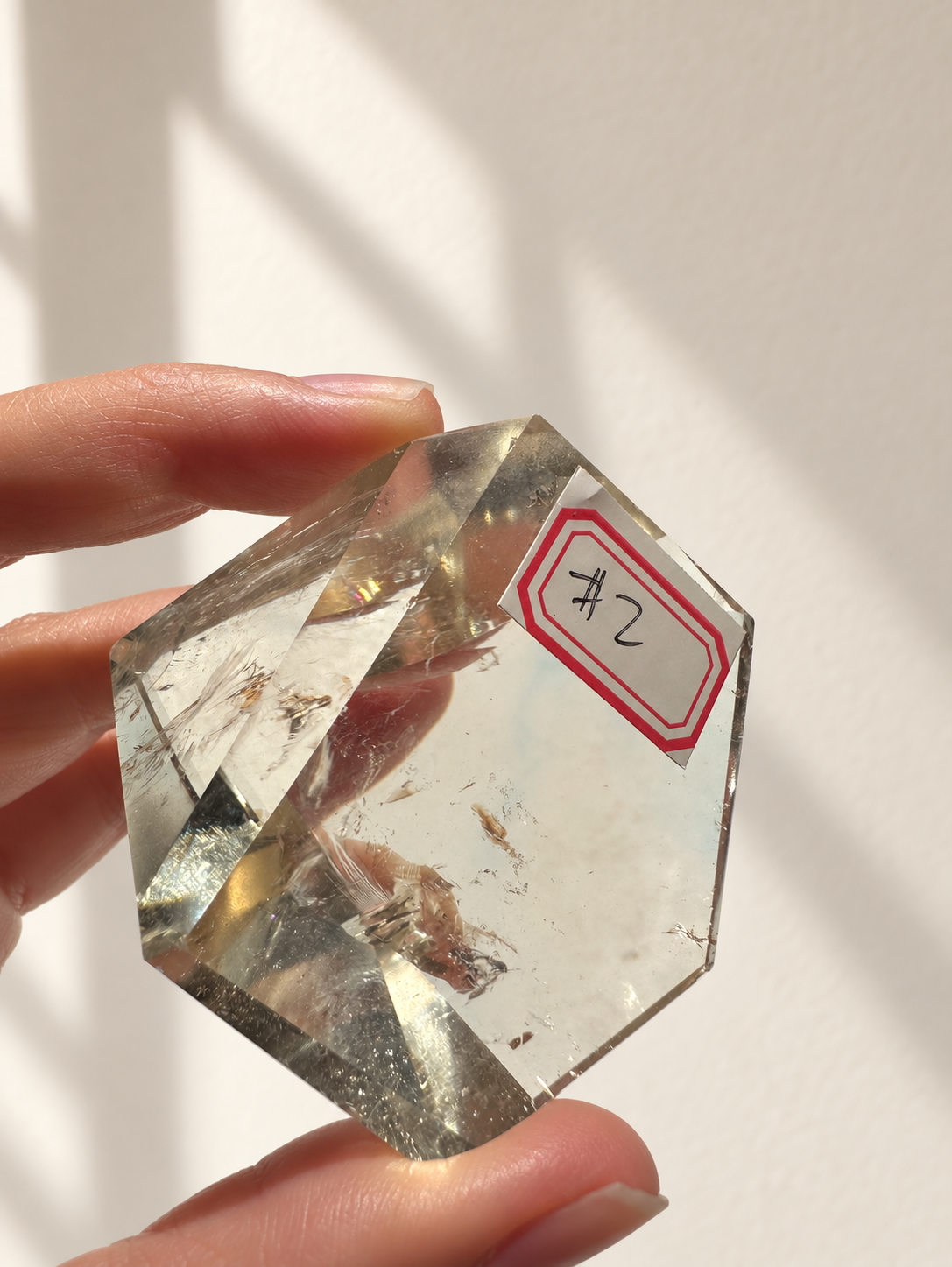 Natural Brazilian citrine 106g exact piece #2 view 5 in soft natural daylight against warm ivory wall