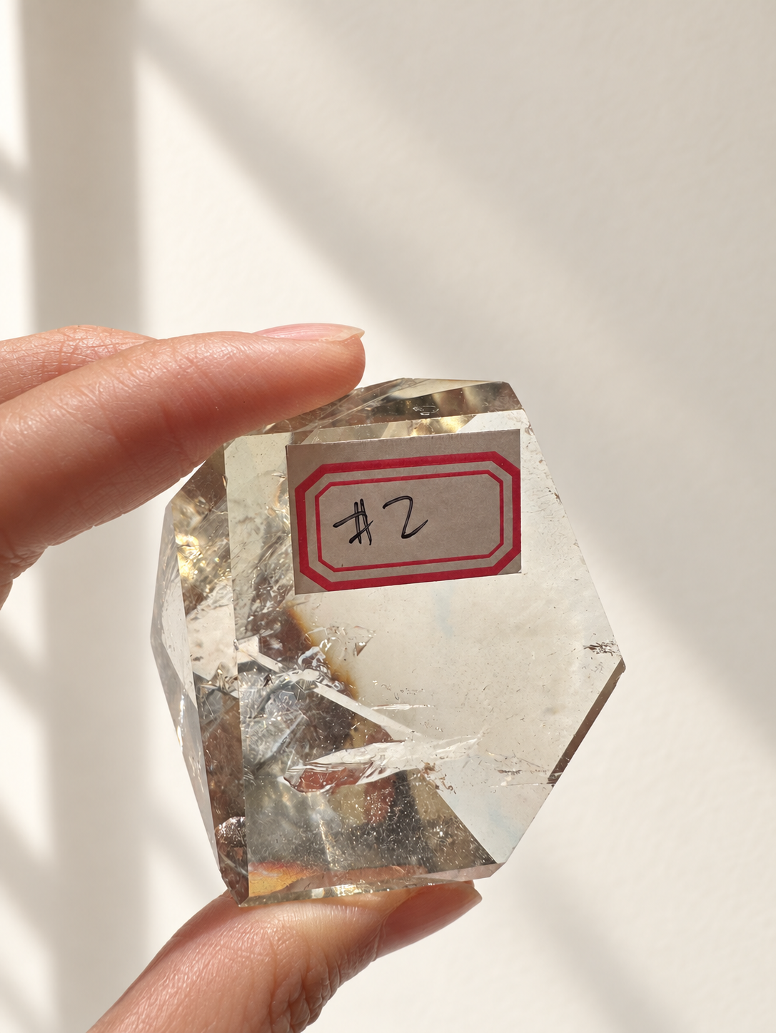 Natural Brazilian citrine 106g exact piece #2 view 8 in soft natural daylight against warm ivory wall