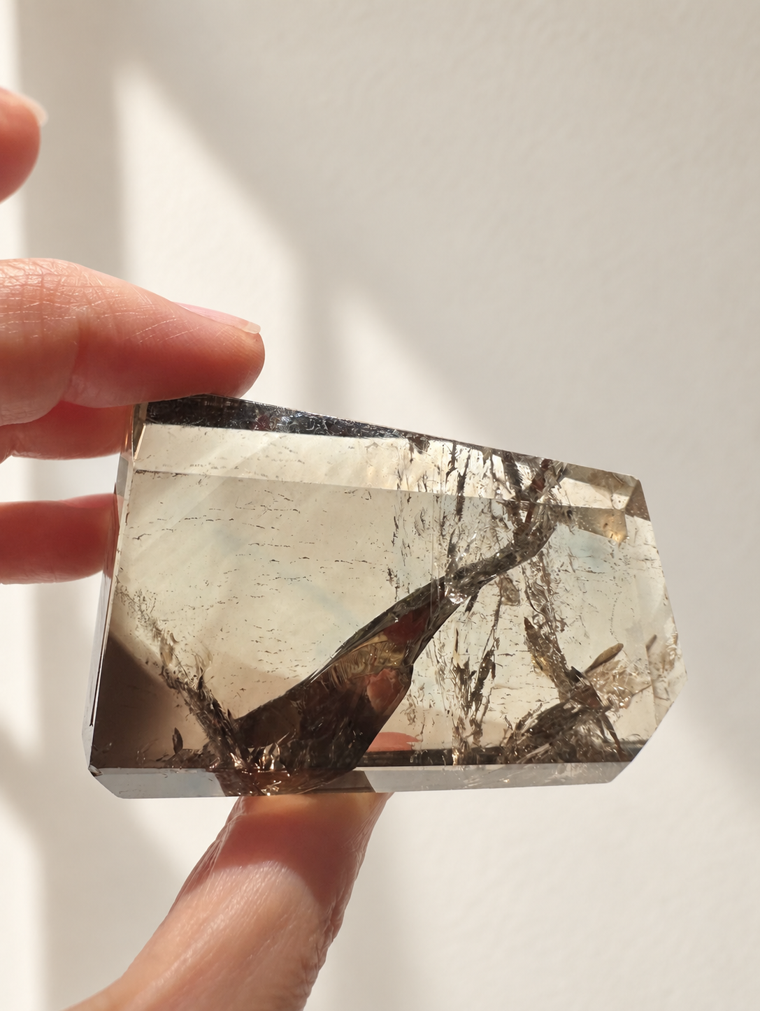 Natural Brazilian citrine 116g exact piece #1 view 2 in soft natural daylight against warm ivory wall