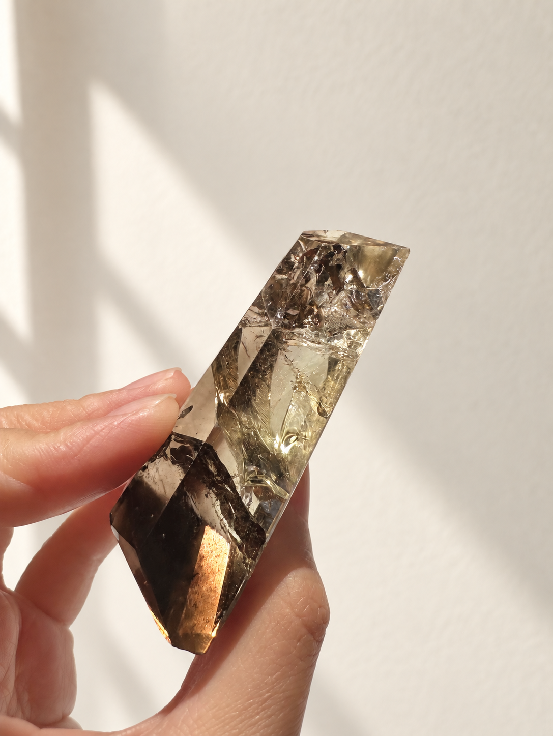 Natural Brazilian citrine 116g exact piece #1 view 6 in soft natural daylight against warm ivory wall