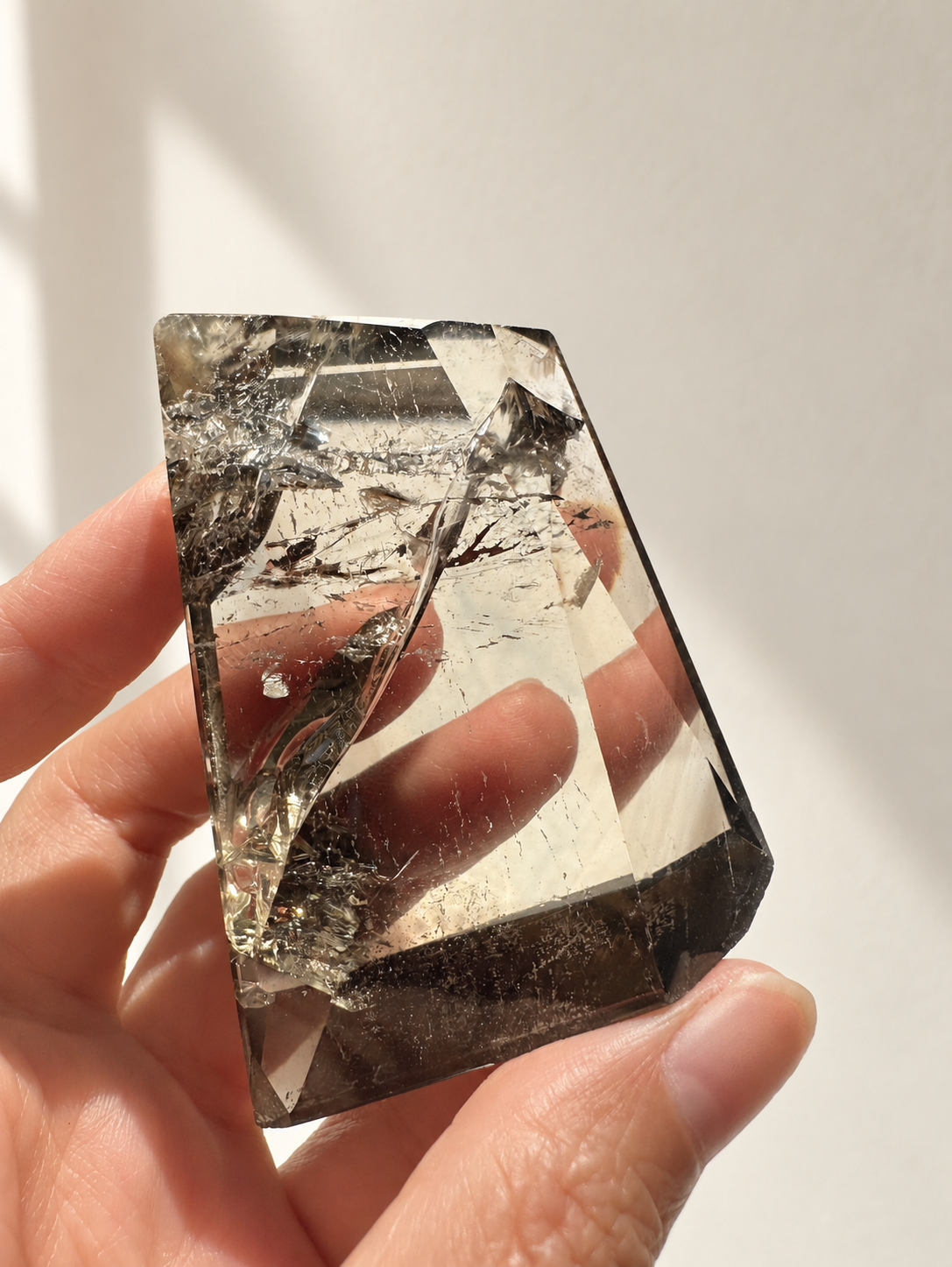 Natural Brazilian citrine 116g exact piece #1 view 7 in soft natural daylight against warm ivory wall