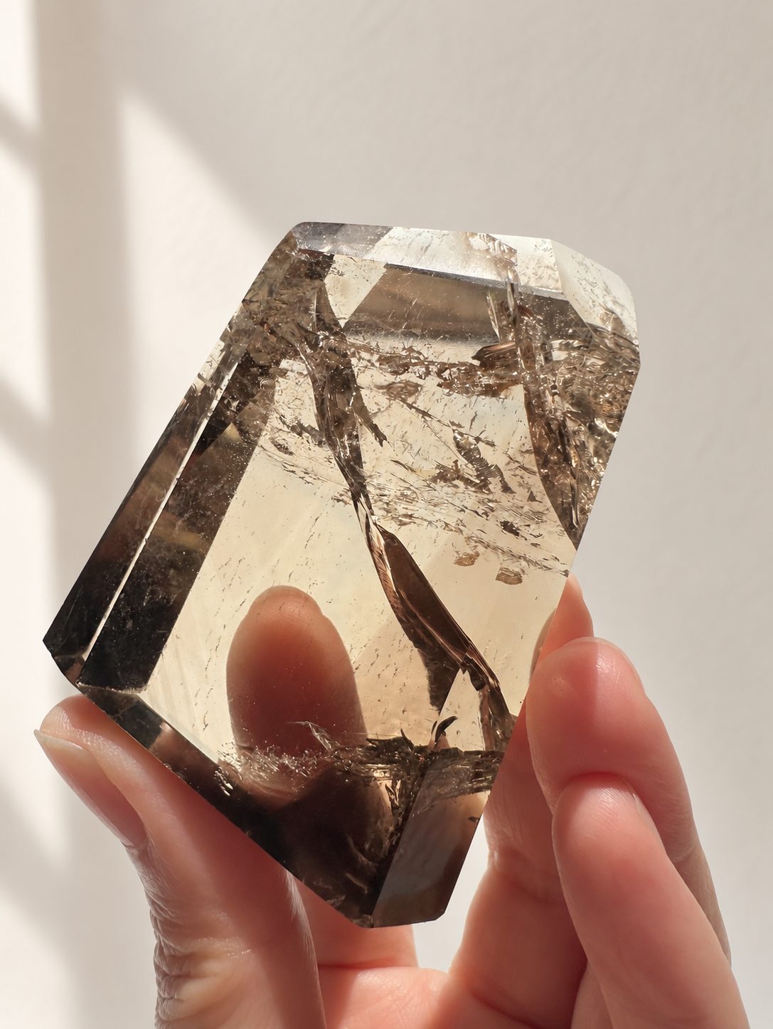 Natural Brazilian citrine 116g exact piece #1 view 8 in soft natural daylight against warm ivory wall