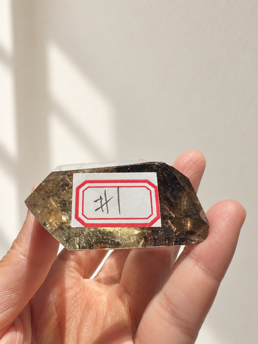 Natural Brazilian citrine 116g exact piece #1 view 9 in soft natural daylight against warm ivory wall