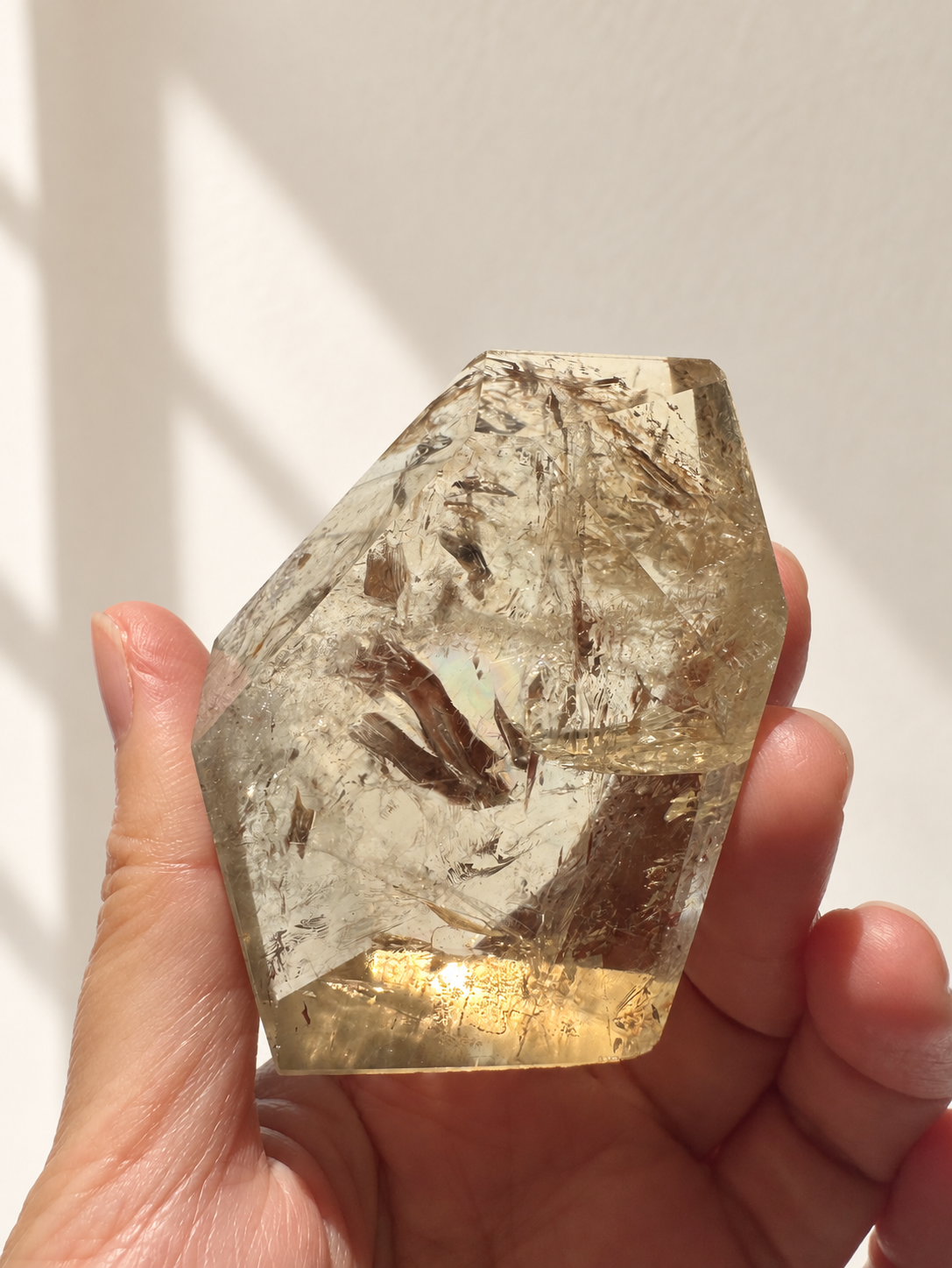Natural Brazilian citrine 118g exact piece #12 view 10 in soft natural daylight against warm ivory wall