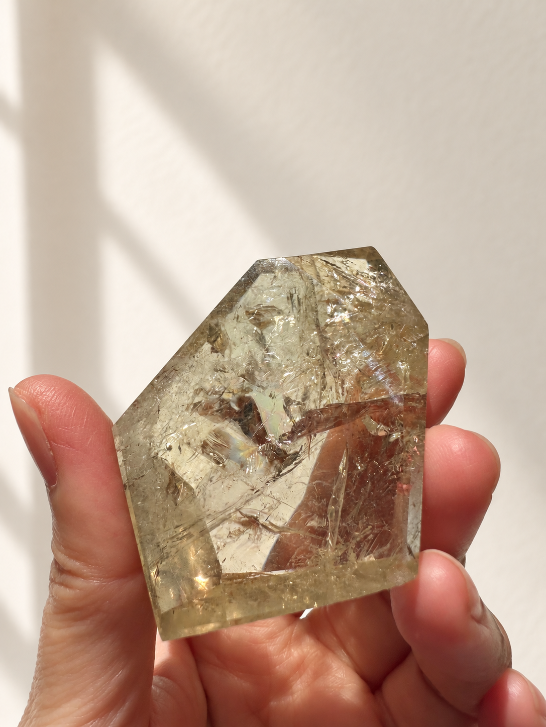 Natural Brazilian citrine 118g exact piece #12 view 12 in soft natural daylight against warm ivory wall