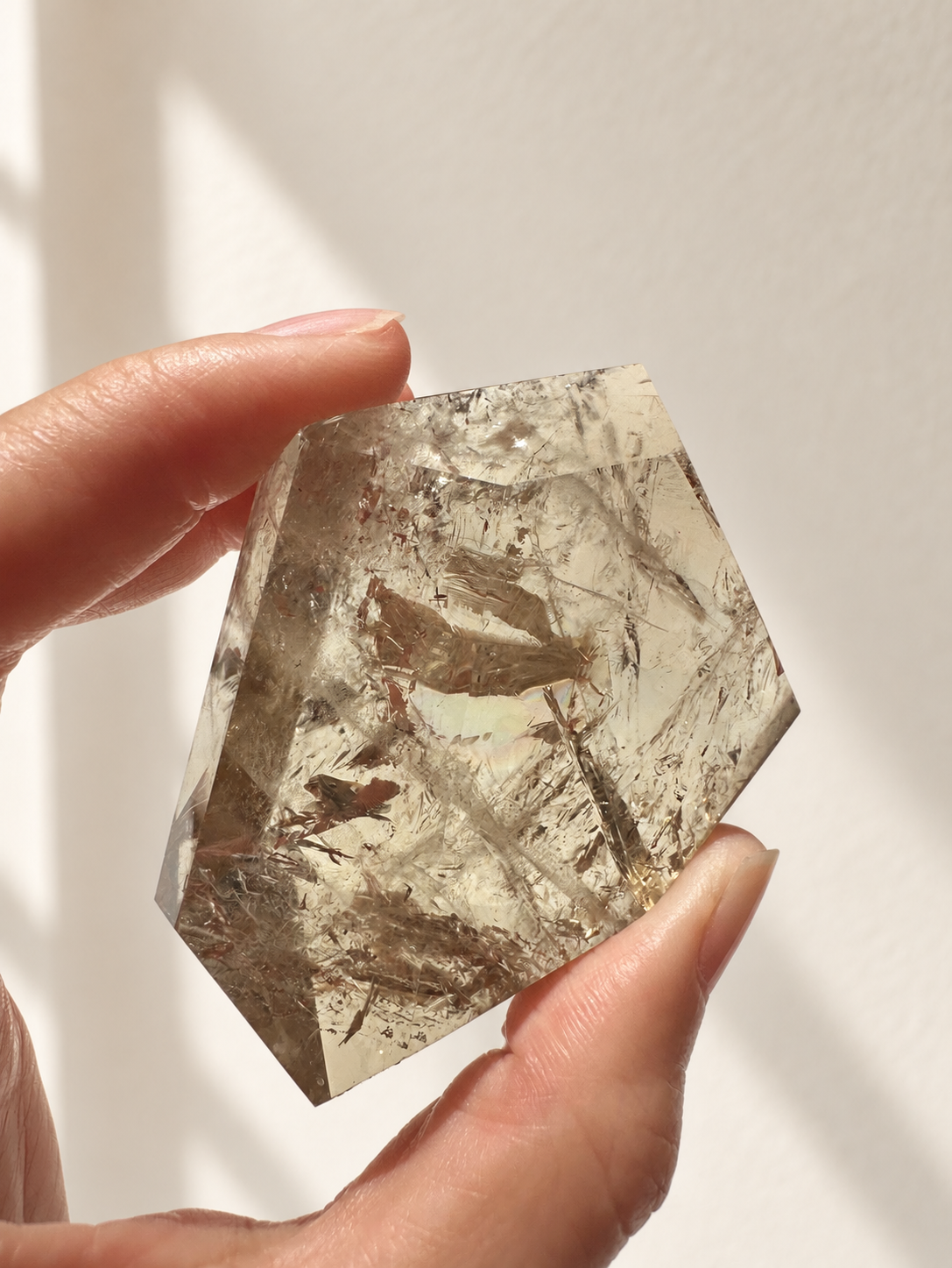 Natural Brazilian citrine 118g exact piece #12 view 8 in soft natural daylight against warm ivory wall