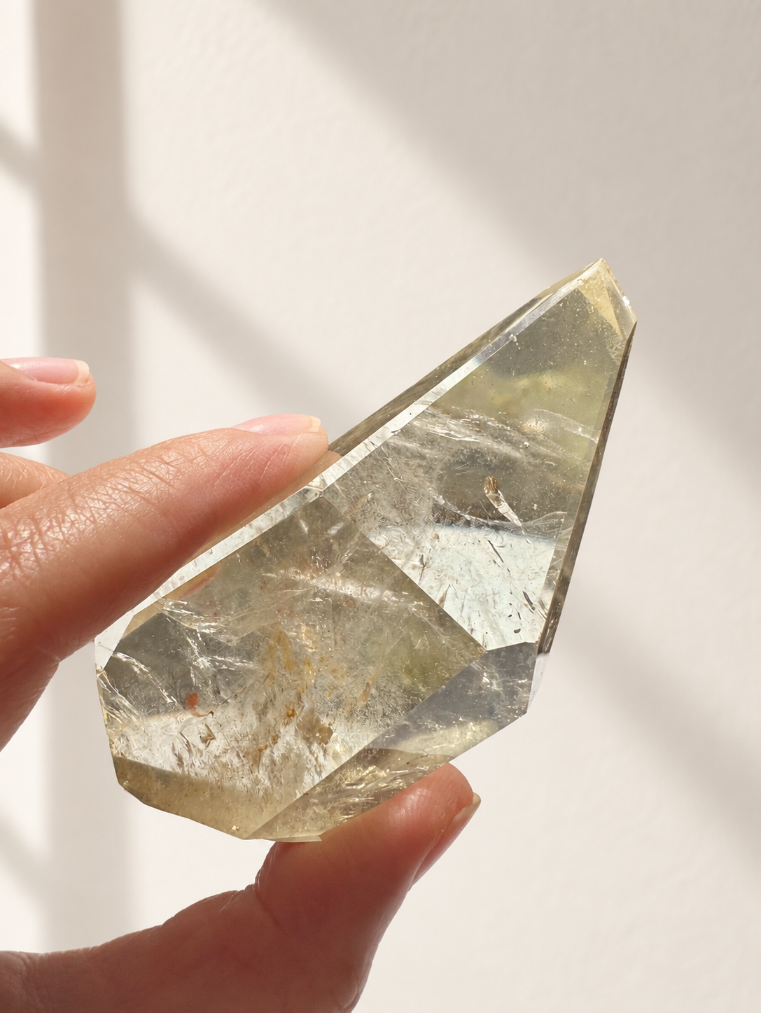 Natural Brazilian citrine 128g exact piece #7 view 10 in soft natural daylight against warm ivory wall