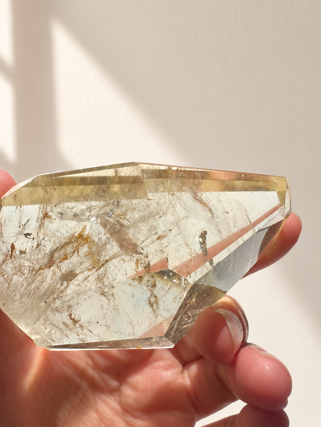 Natural Brazilian citrine 128g exact piece #7 view 5 in soft natural daylight against warm ivory wall