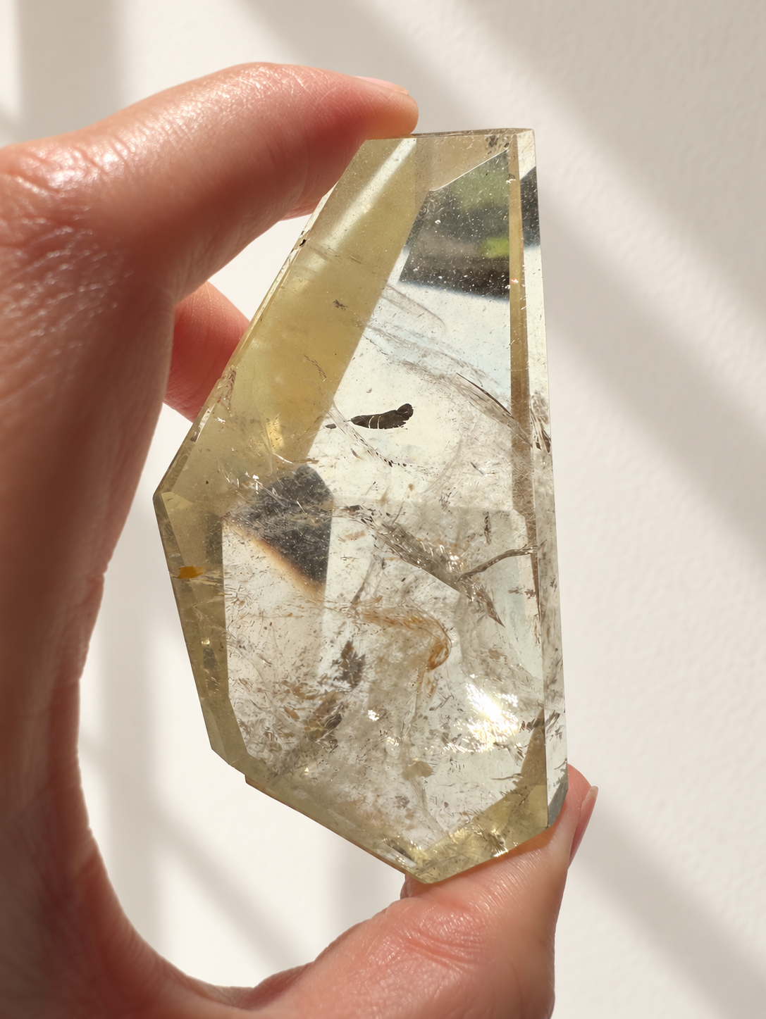 Natural Brazilian citrine 128g exact piece #7 view 7 in soft natural daylight against warm ivory wall