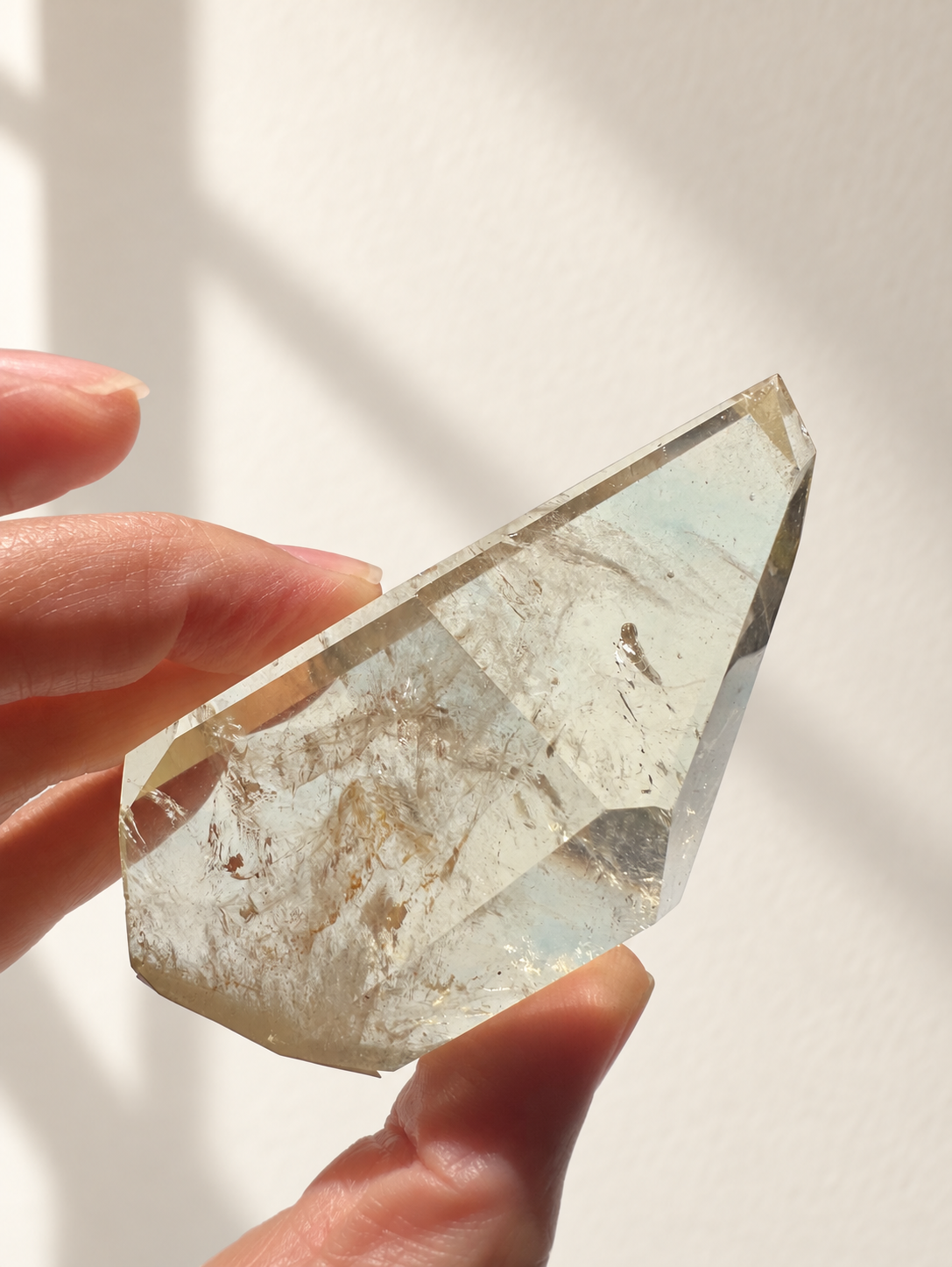 Natural Brazilian citrine 128g exact piece #7 view 8 in soft natural daylight against warm ivory wall