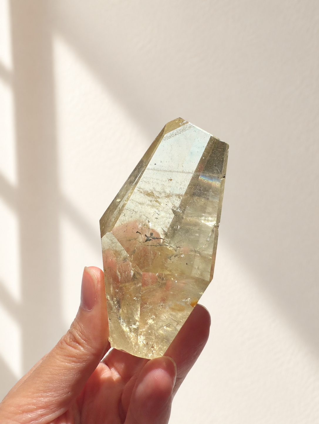 Natural Brazilian citrine 128g exact piece #7 view 9 in soft natural daylight against warm ivory wall