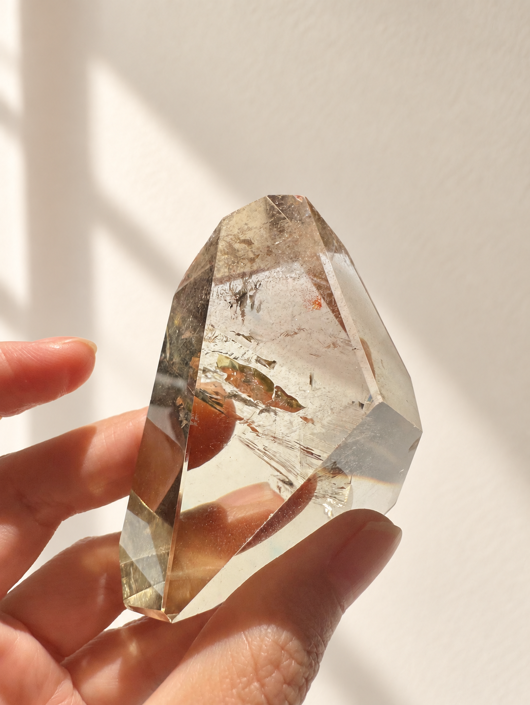 Natural Brazilian citrine 129g exact piece #4 view 12 in soft natural daylight against warm ivory wall