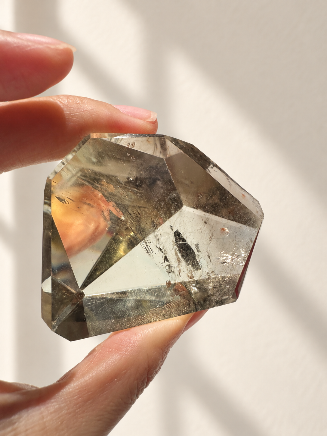 Natural Brazilian citrine 129g exact piece #4 view 2 in soft natural daylight against warm ivory wall