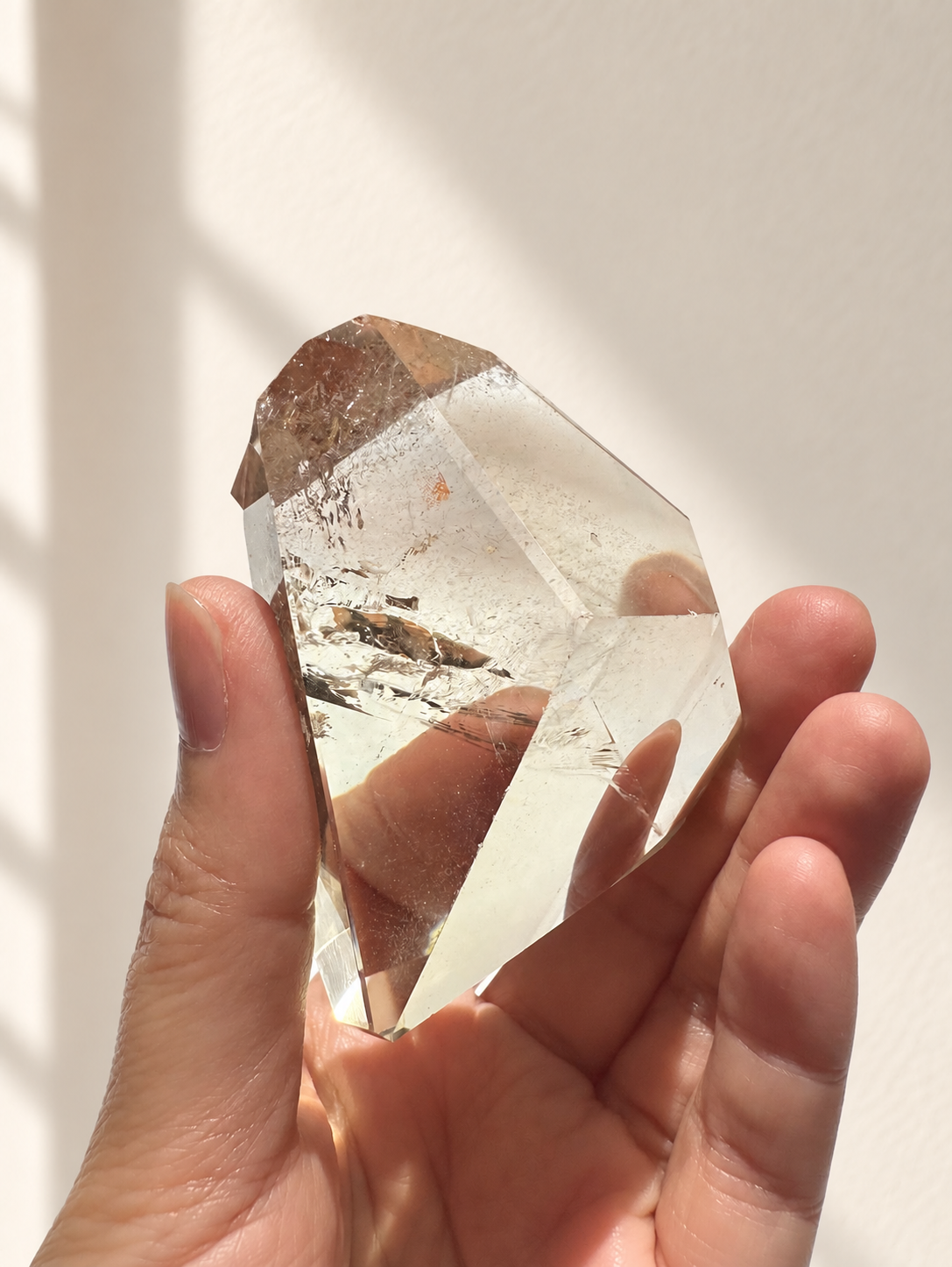Natural Brazilian citrine 129g exact piece #4 view 4 in soft natural daylight against warm ivory wall