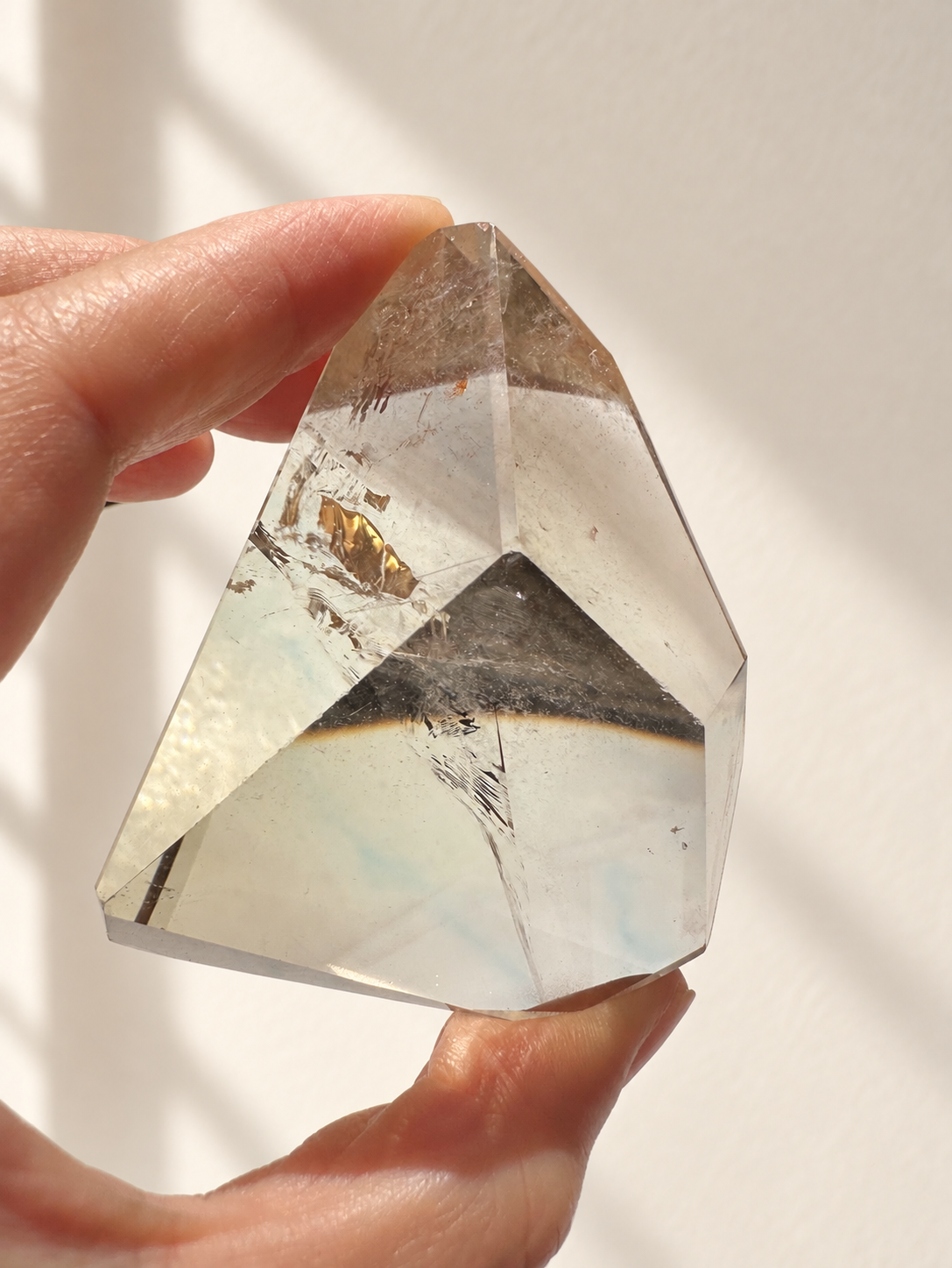 Natural Brazilian citrine 129g exact piece #4 view 5 in soft natural daylight against warm ivory wall