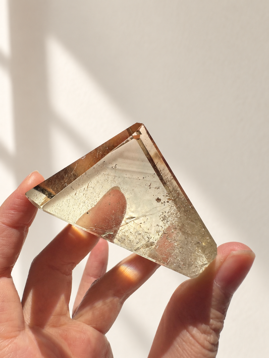Exact citrine piece #6, 135g — main photo with soft indoor natural light and cream wall background