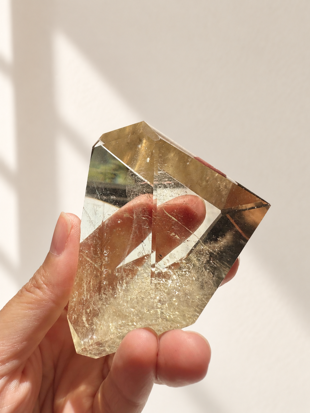 Natural Brazilian citrine 135g exact piece #6 view 10 in soft natural daylight against warm ivory wall